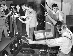 Sound effects guys at work doing a live old time radio broadcast